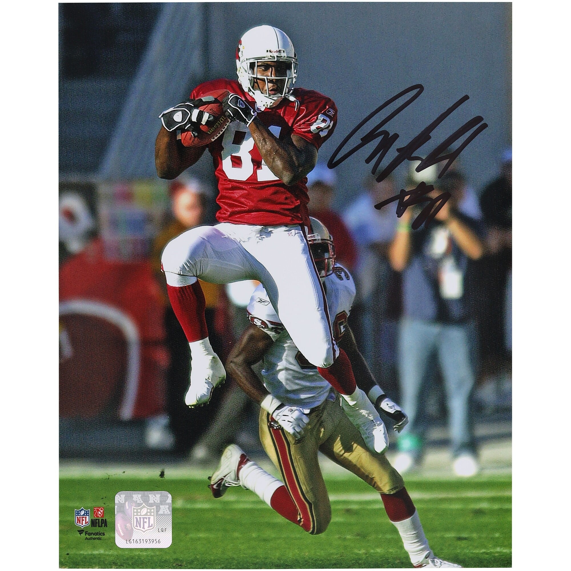 Photo verticale 8" x 10" autographiée d'Anquan Boldin, joueur des Cardinals de l'Arizona, en plein saut et réception.
