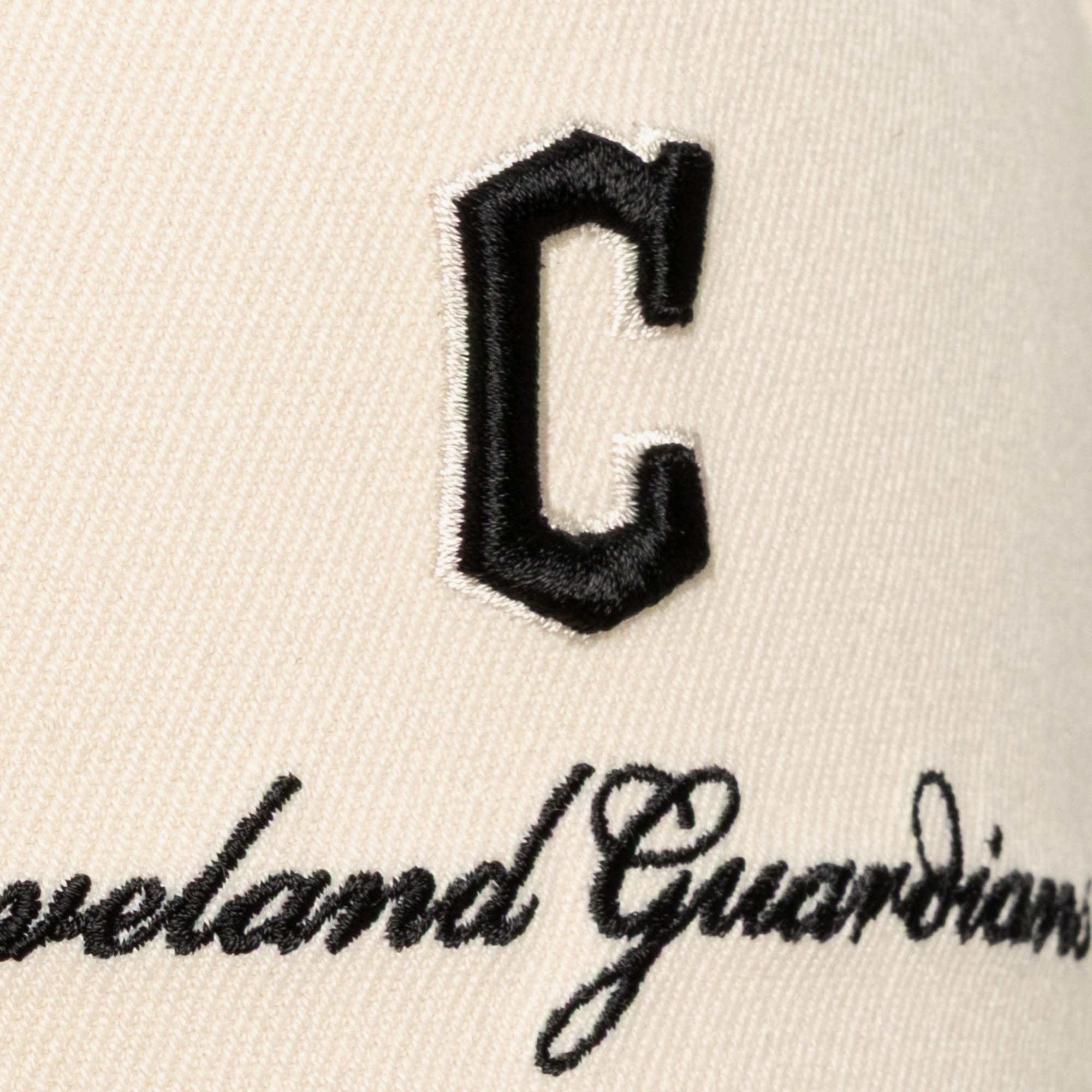 Men's Mitchell & Ness Cream/Black Cleveland Guardians Flawless Stretch Snapback Hat