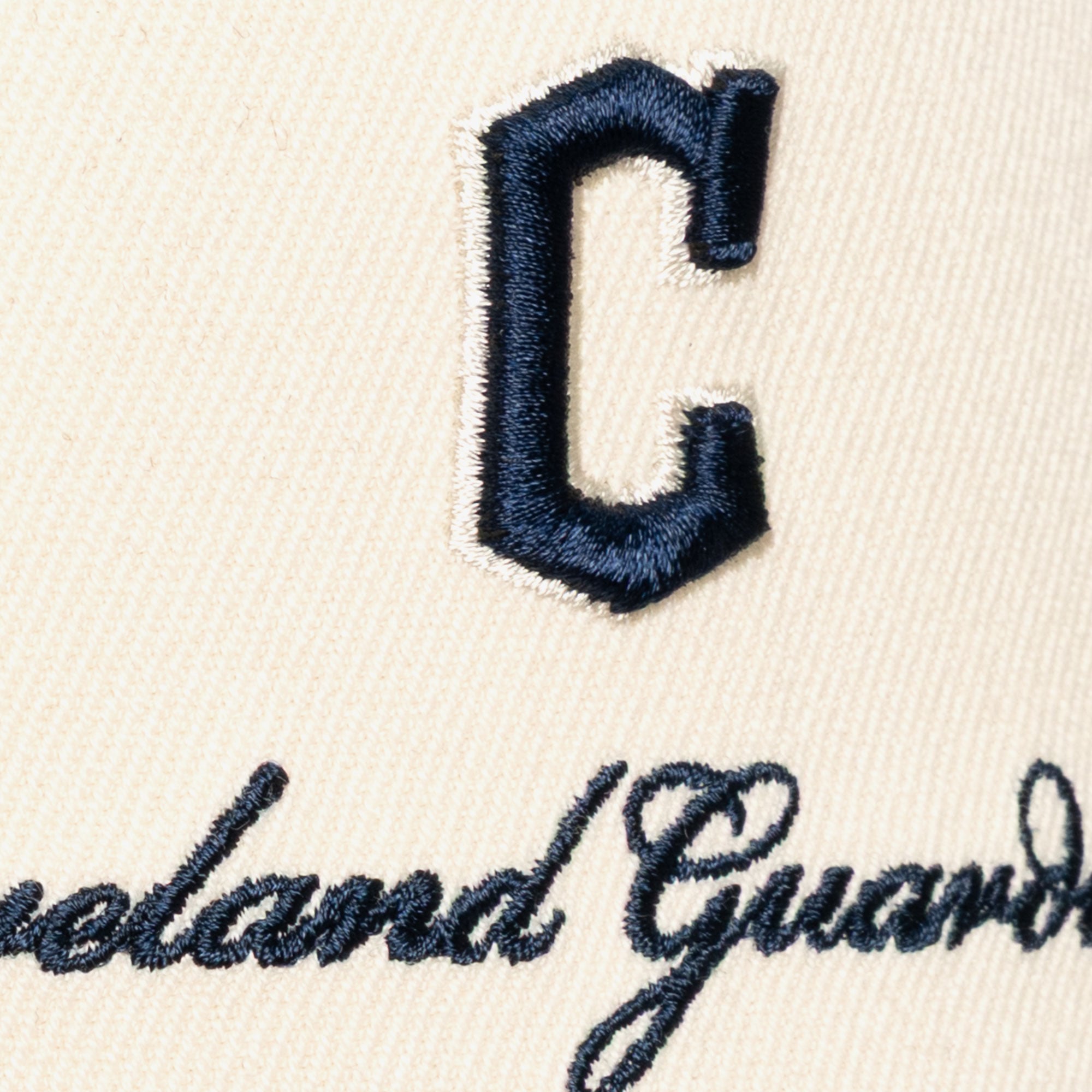 Men's Mitchell & Ness Cream/Navy Cleveland Guardians Flawless Stretch-Snapback Hat