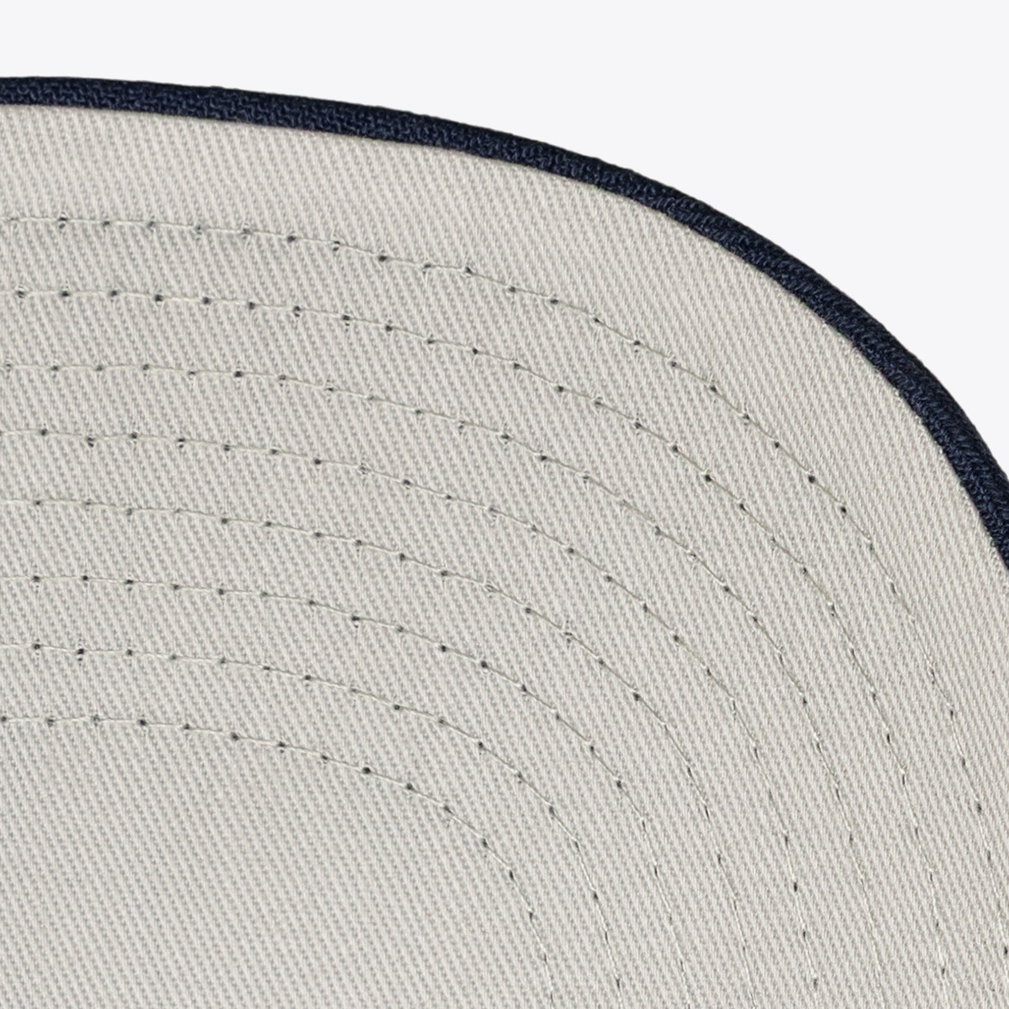 Men's Mitchell & Ness Cream/Navy Cleveland Guardians Flawless Stretch-Snapback Hat