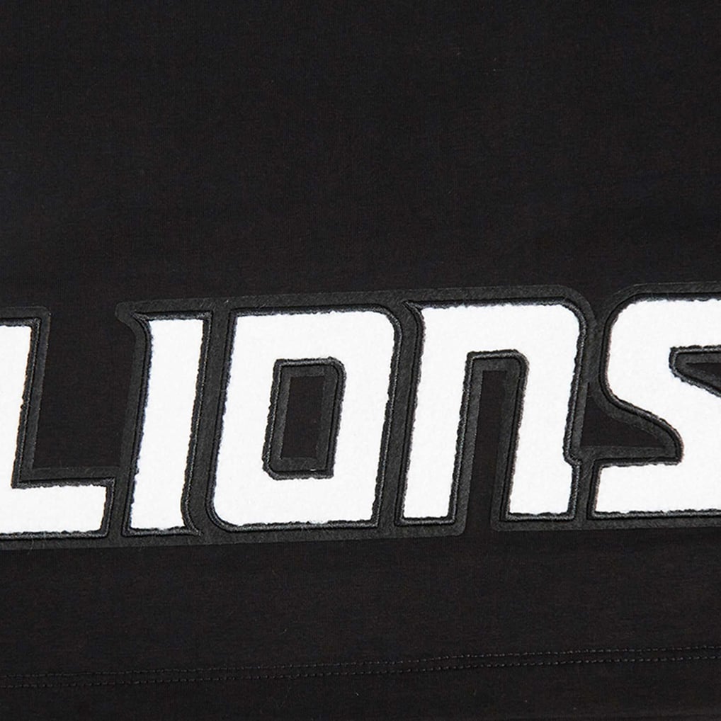 T-shirt court et boxy pour femme Amon-Ra St. Brown Detroit Lions Pro Standard avec nom et numéro de joueur - Noir