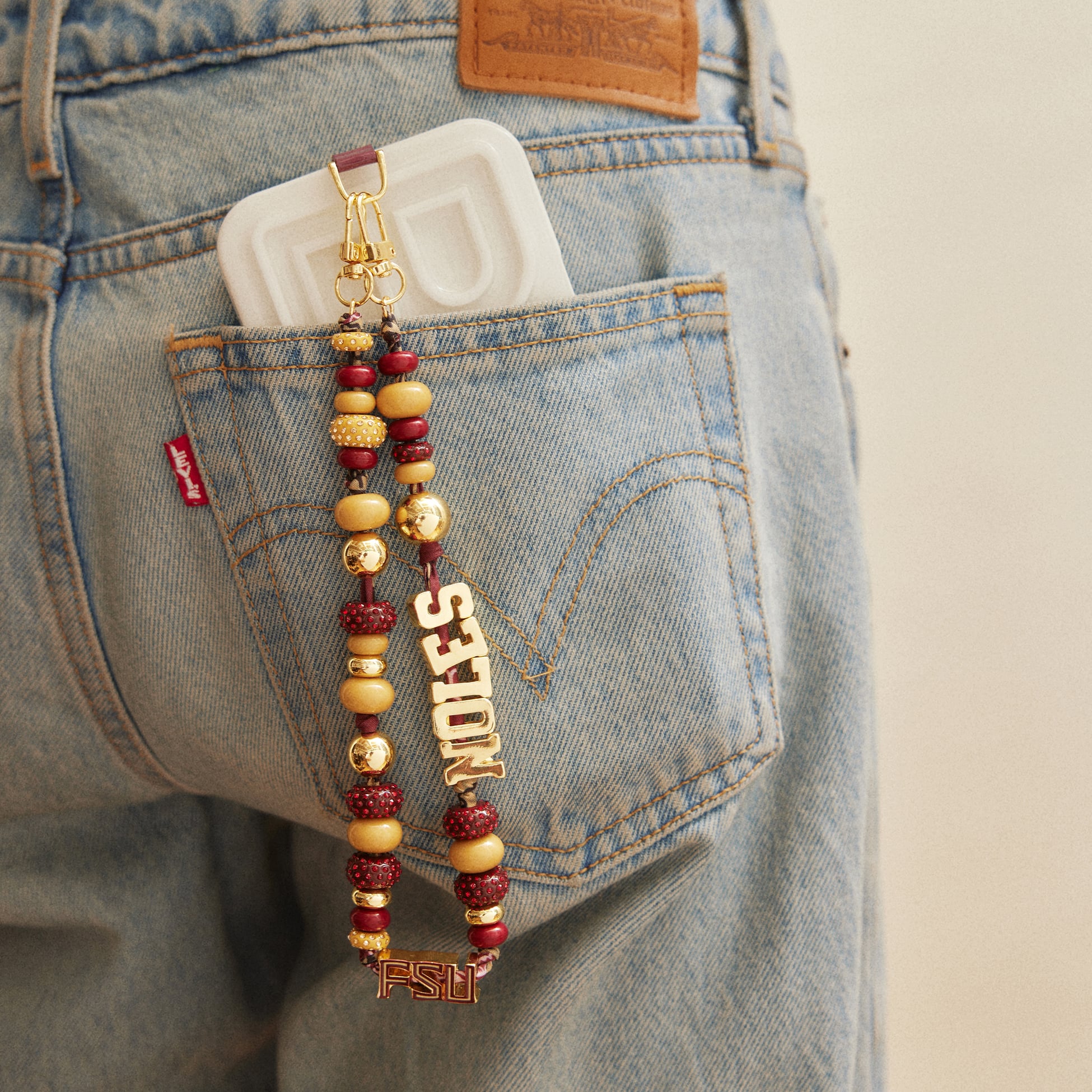 Lanière de téléphone perlée BaubleBar Florida State Seminoles