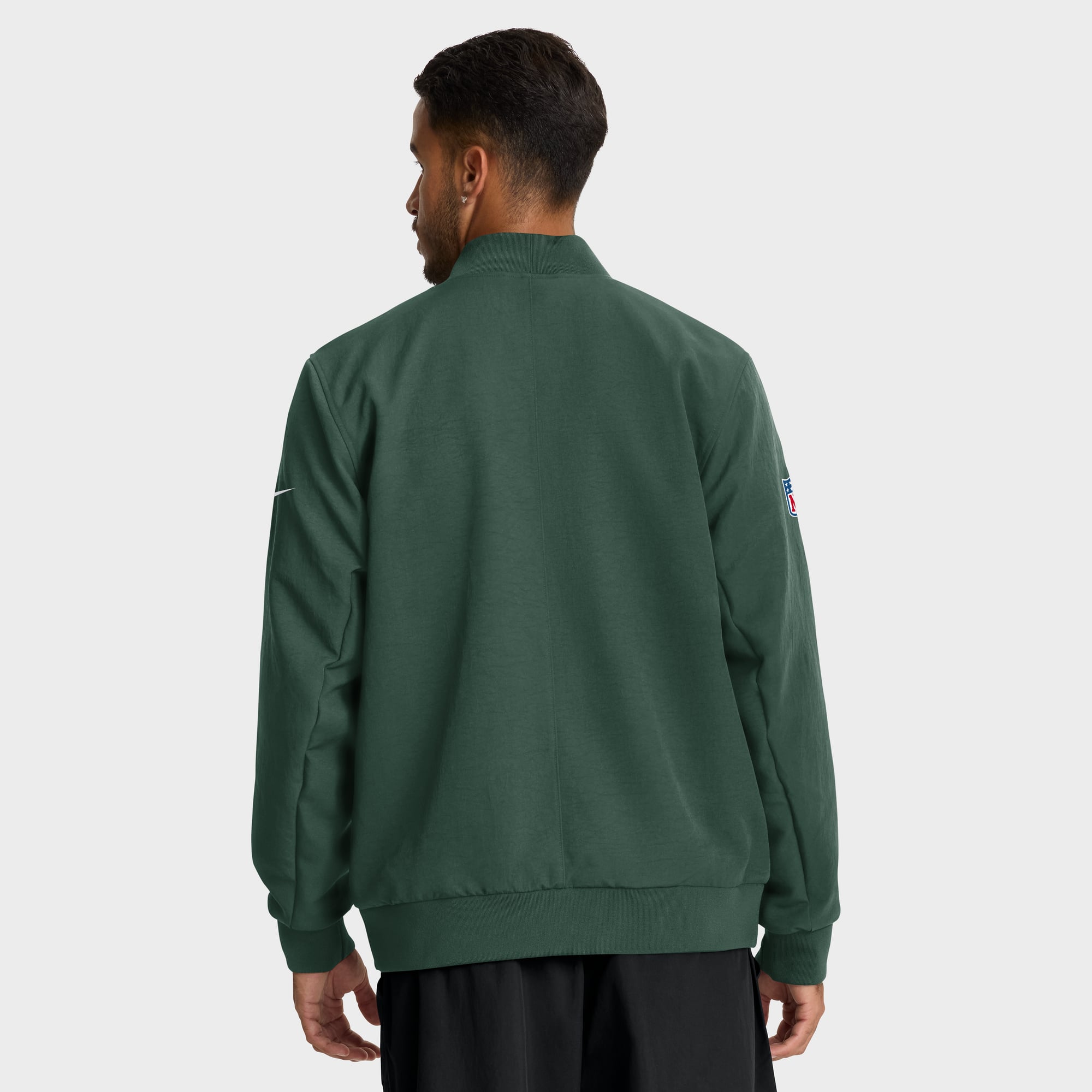 Veste bomber zippée Nike Green Bay Packers pour homme, modèle Sideline Powerful Blocking Dri-FIT, couleur verte.