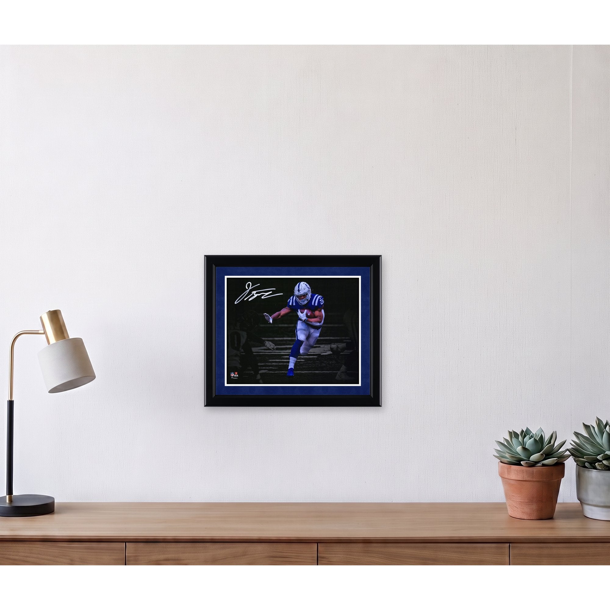 Jonathan Taylor Indianapolis Colts Autographed 11" x 14" Stiff Arm Spotlight Photograph