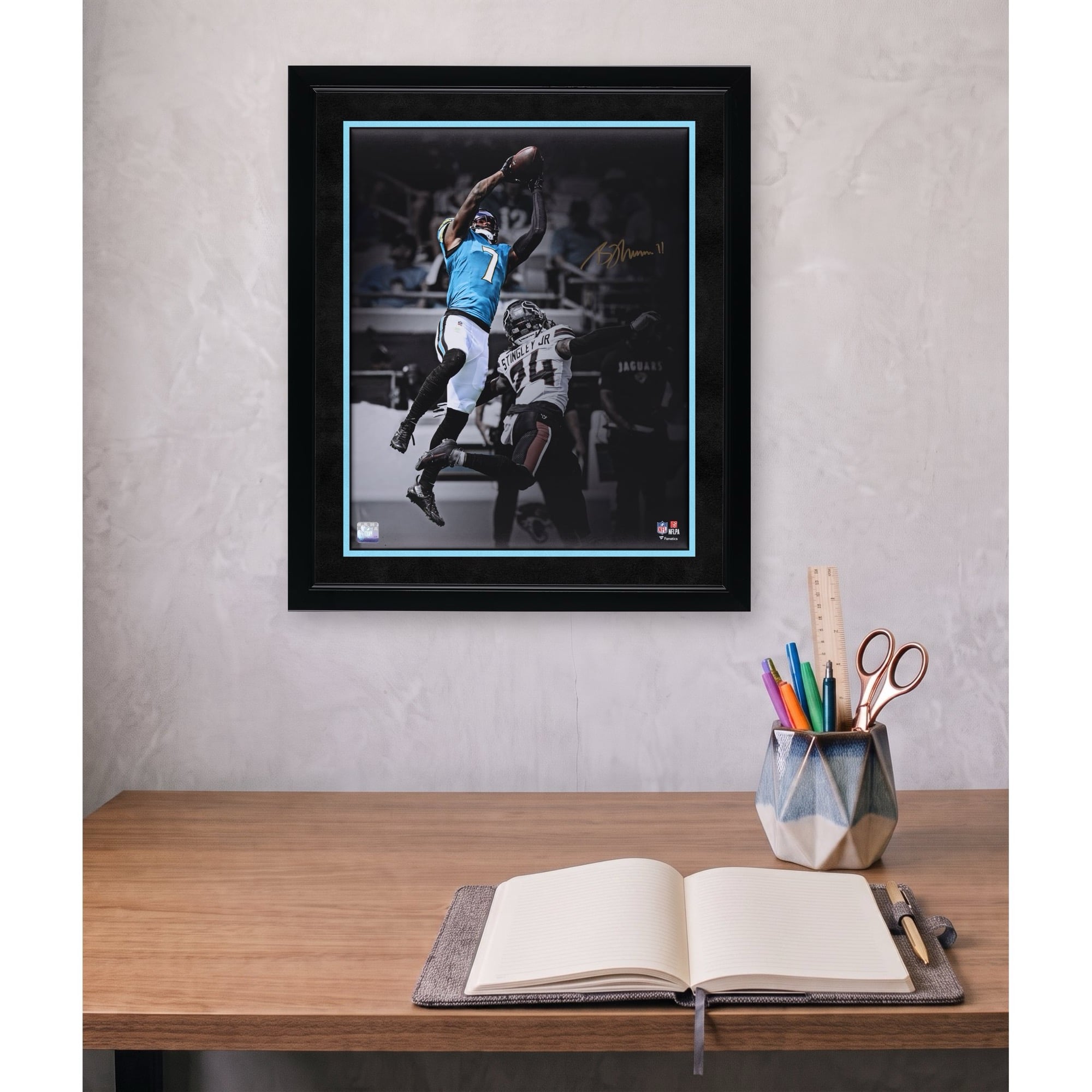 Brian Thomas Jr. Jacksonville Jaguars Autographed 16" x 20" Leaping Catch Spotlight Photograph