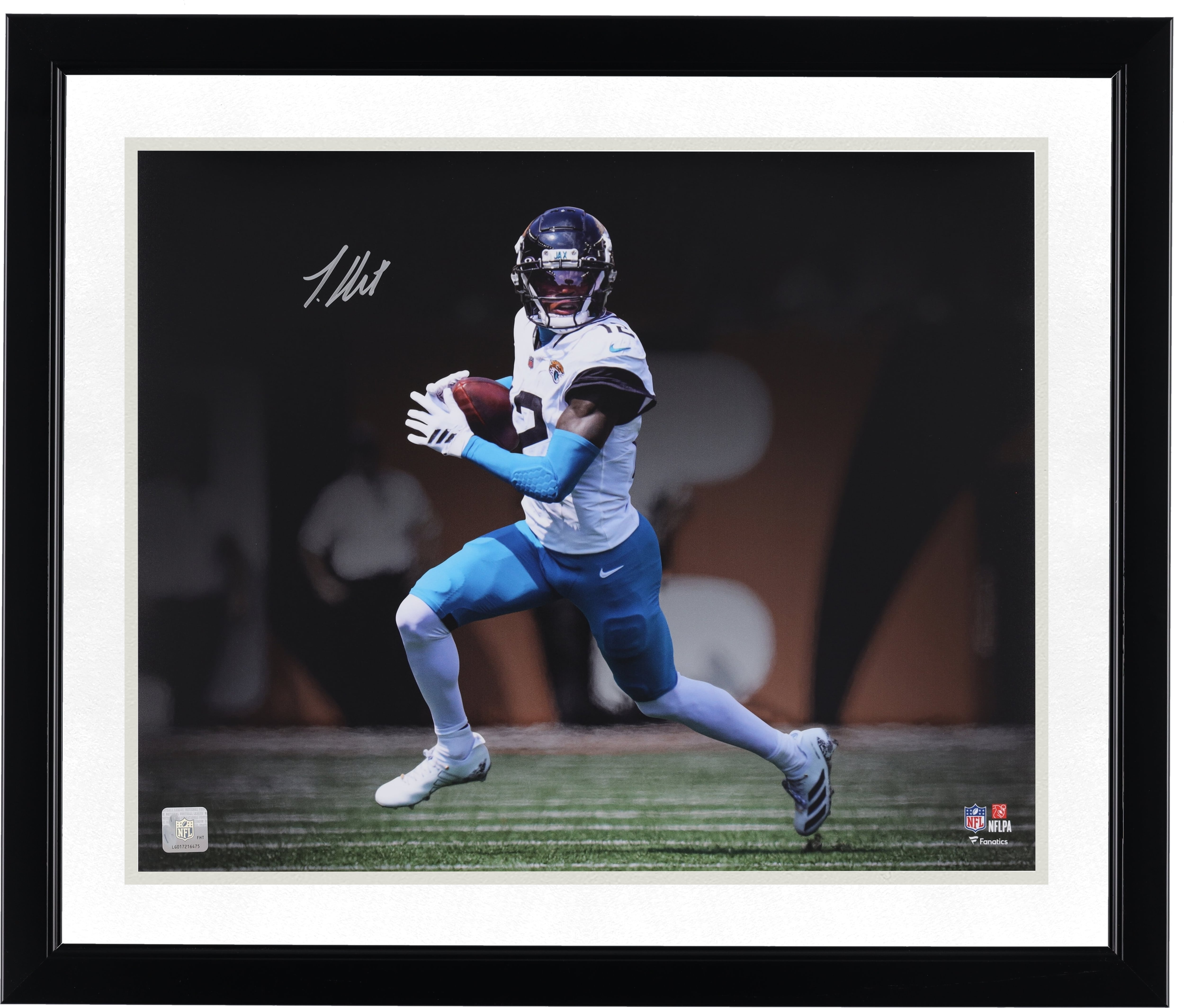 Travis Hunter Jacksonville Jaguars Autographed 16" x 20" White Jersey Running Spotlight Photograph