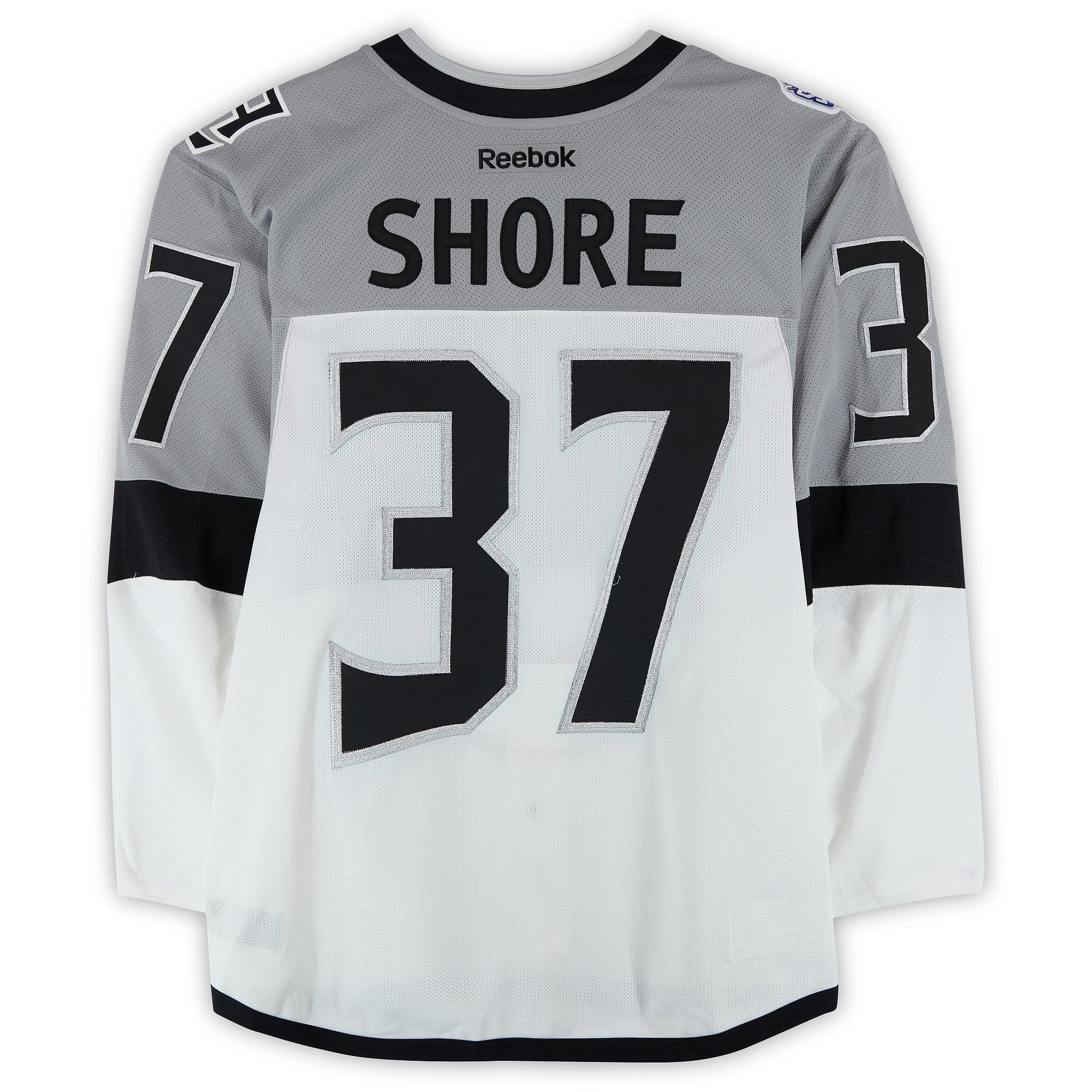 Maillot blanc n° 37 porté par Nick Shore lors de l'entraînement des Kings de Los Angeles contre les Sharks de San Jose le 21 février 2015