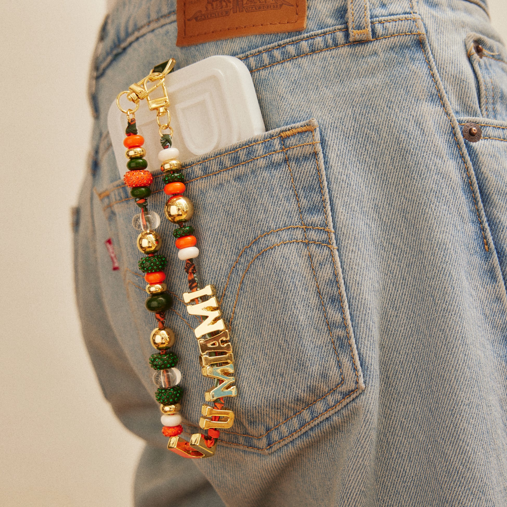Lanière de téléphone perlée BaubleBar Miami Hurricanes