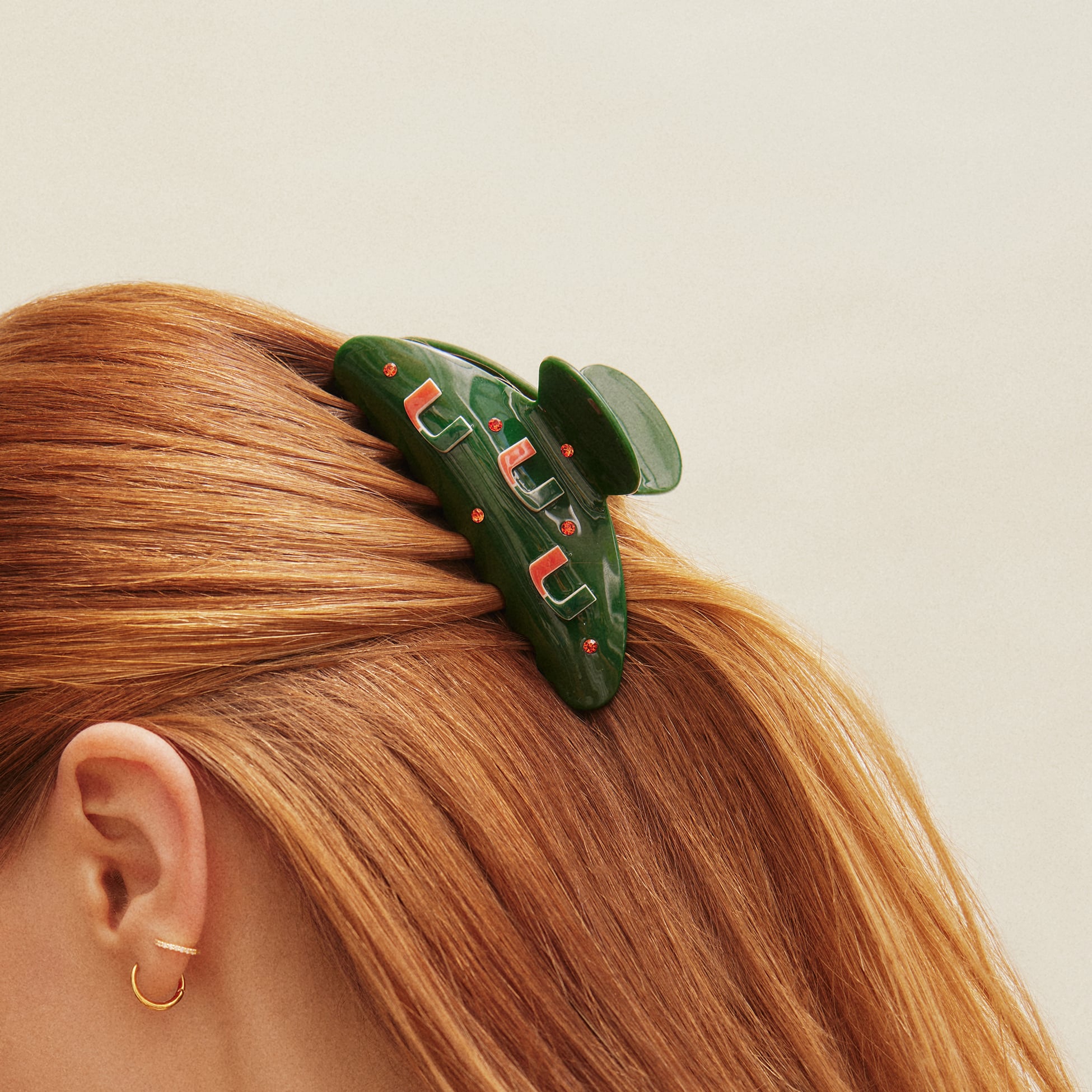 Pince à cheveux BaubleBar avec logo des Miami Hurricanes