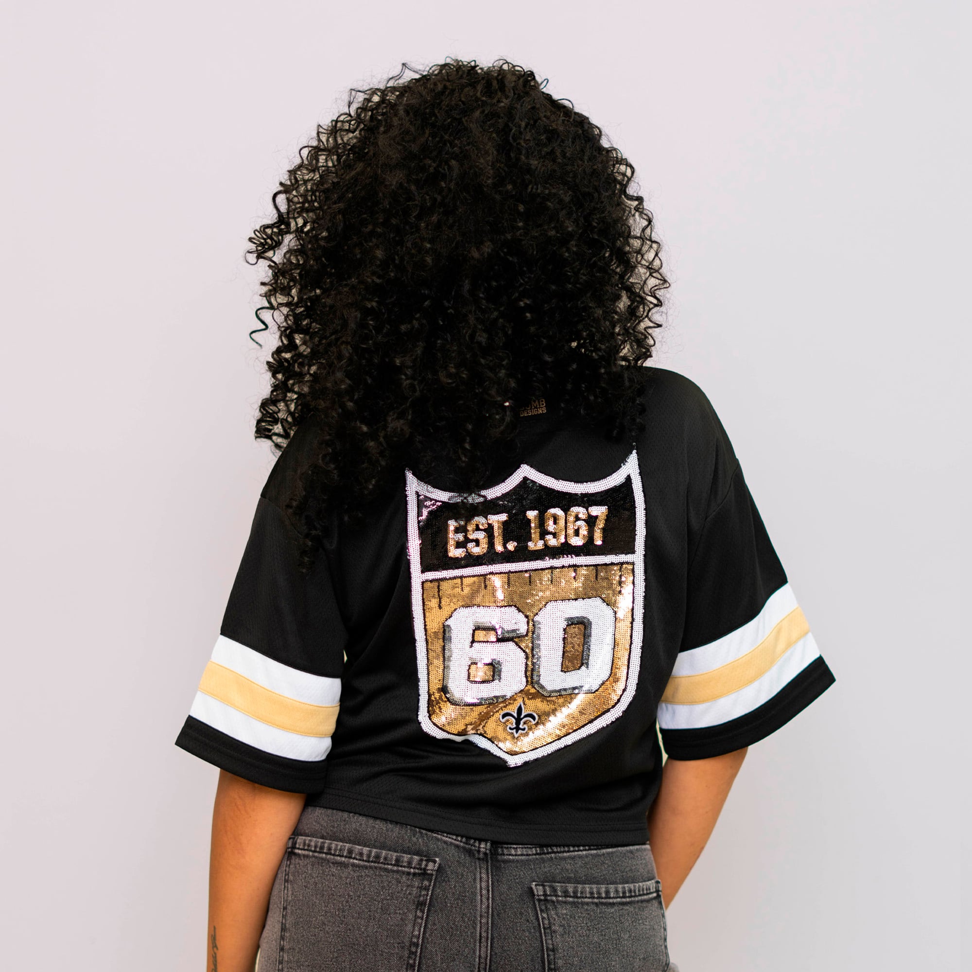 T-shirt court noir Bomb Designs pour femmes, commémorant le 60e anniversaire des Saints de la Nouvelle-Orléans