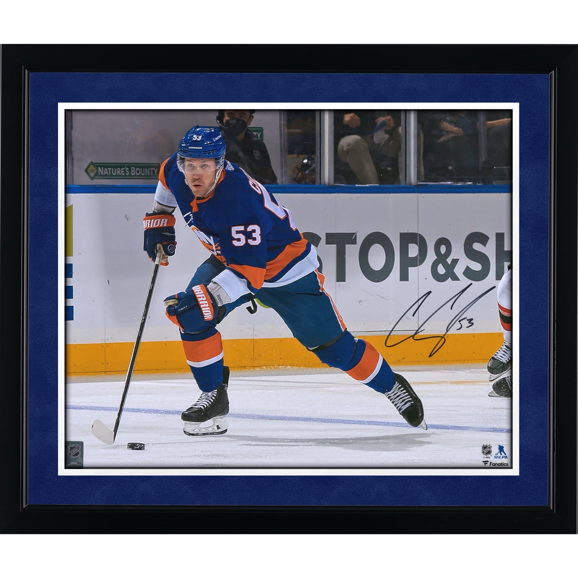 Casey Cizikas New York Islanders Autographed 16" x 20" Blue Jersey Skating with Puck Photograph