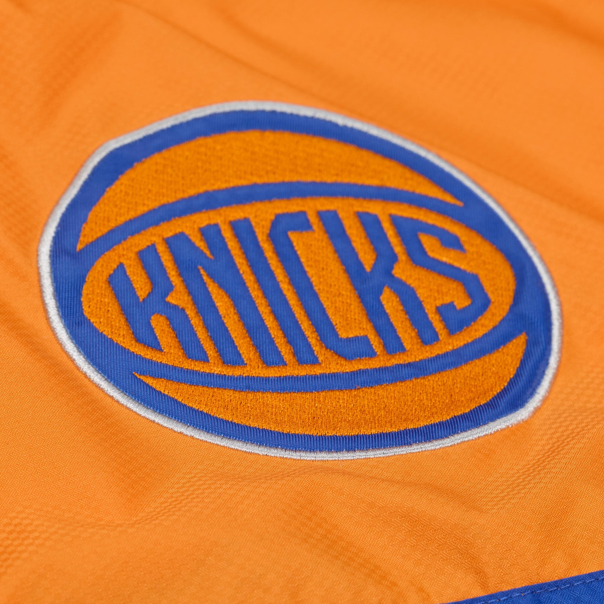 Veste coupe-vent demi-zip Mitchell & Ness bleue à carreaux triple motif New York Knicks pour homme