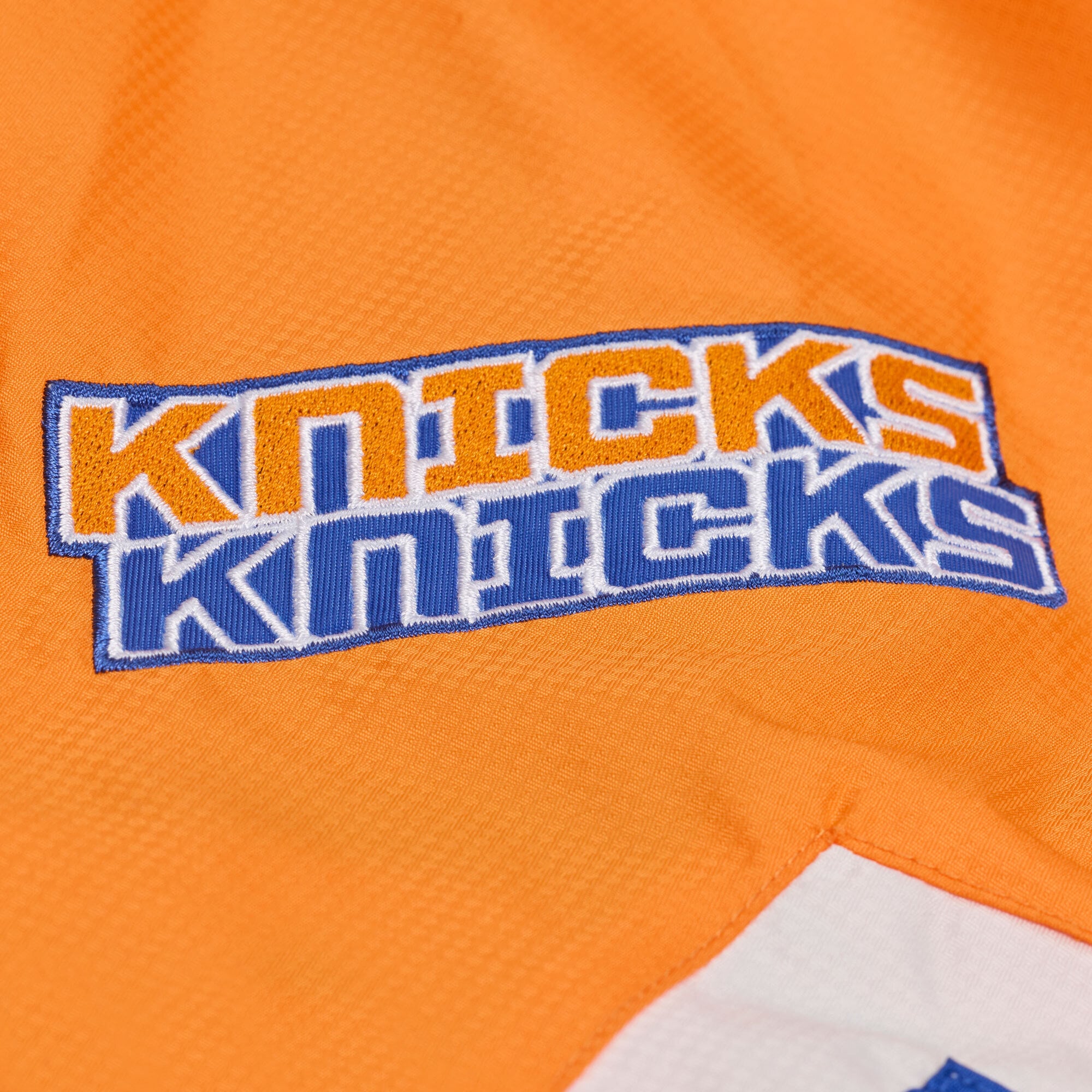 Veste coupe-vent demi-zip Mitchell & Ness bleue à carreaux triple motif New York Knicks pour homme