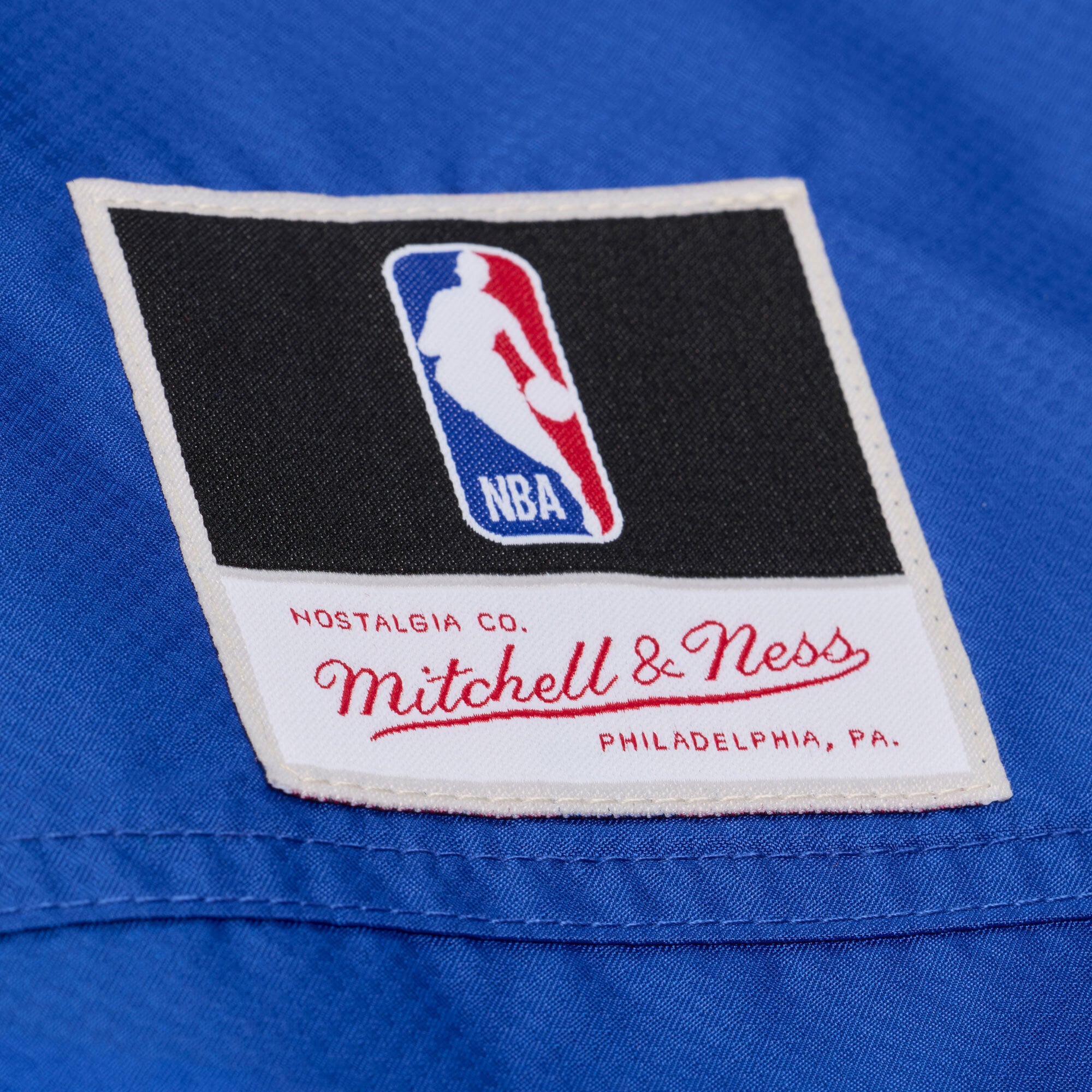 Veste coupe-vent demi-zip Mitchell & Ness bleue à carreaux triple motif New York Knicks pour homme