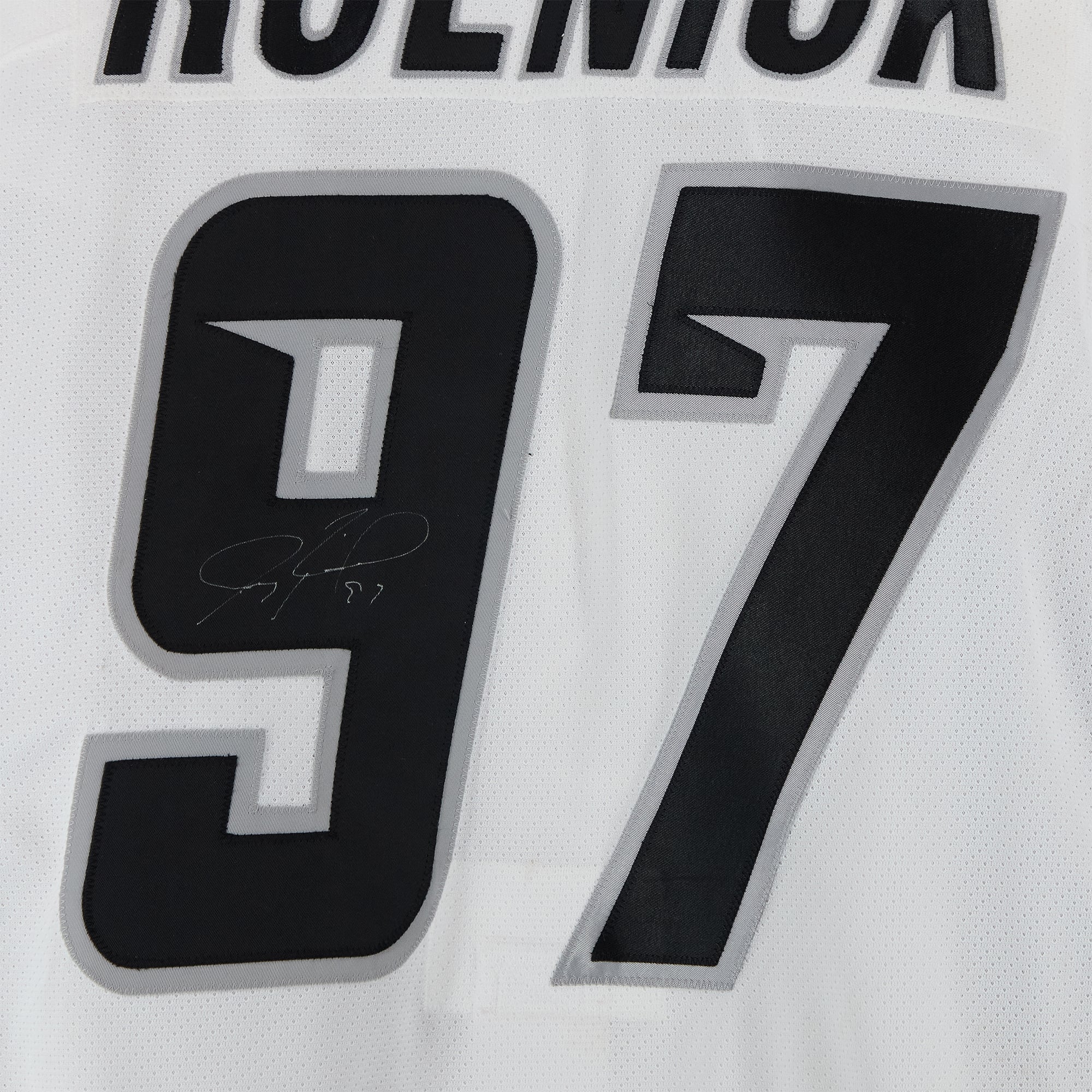 Maillot blanc n° 97 autographié par Jeremy Roenick, porté par l'équipe de la Conférence Est lors du Match des étoiles de la LNH 2003.