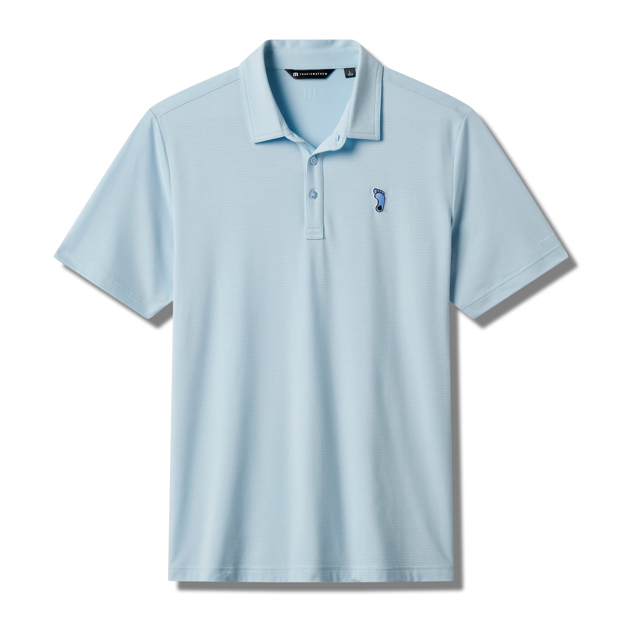 Polo TravisMathew Carolina Blue pour homme, modèle Halftime Show Heater de North Tar Heels.
