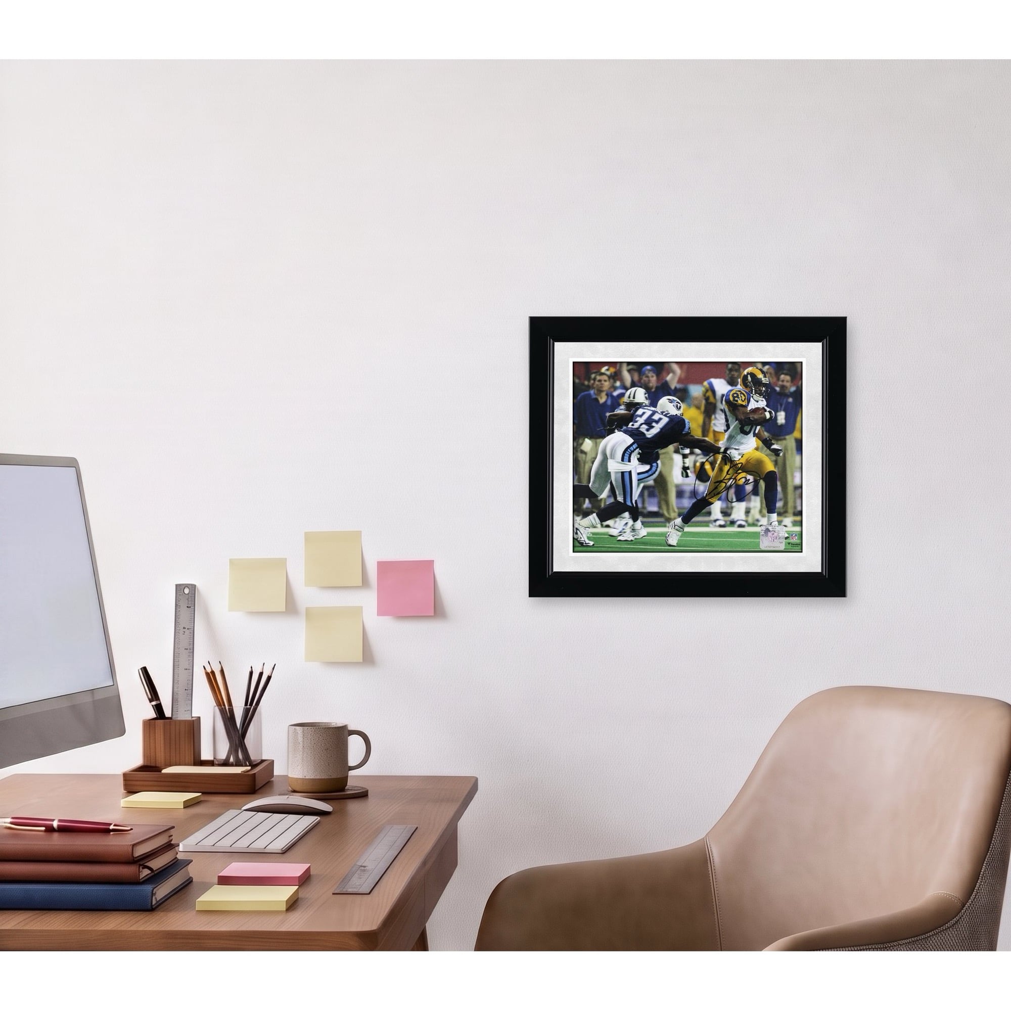 Photo dédicacée d'Isaac Bruce, joueur des Rams de Saint-Louis, lors du Super Bowl XXXIV (8 x 10 pouces).