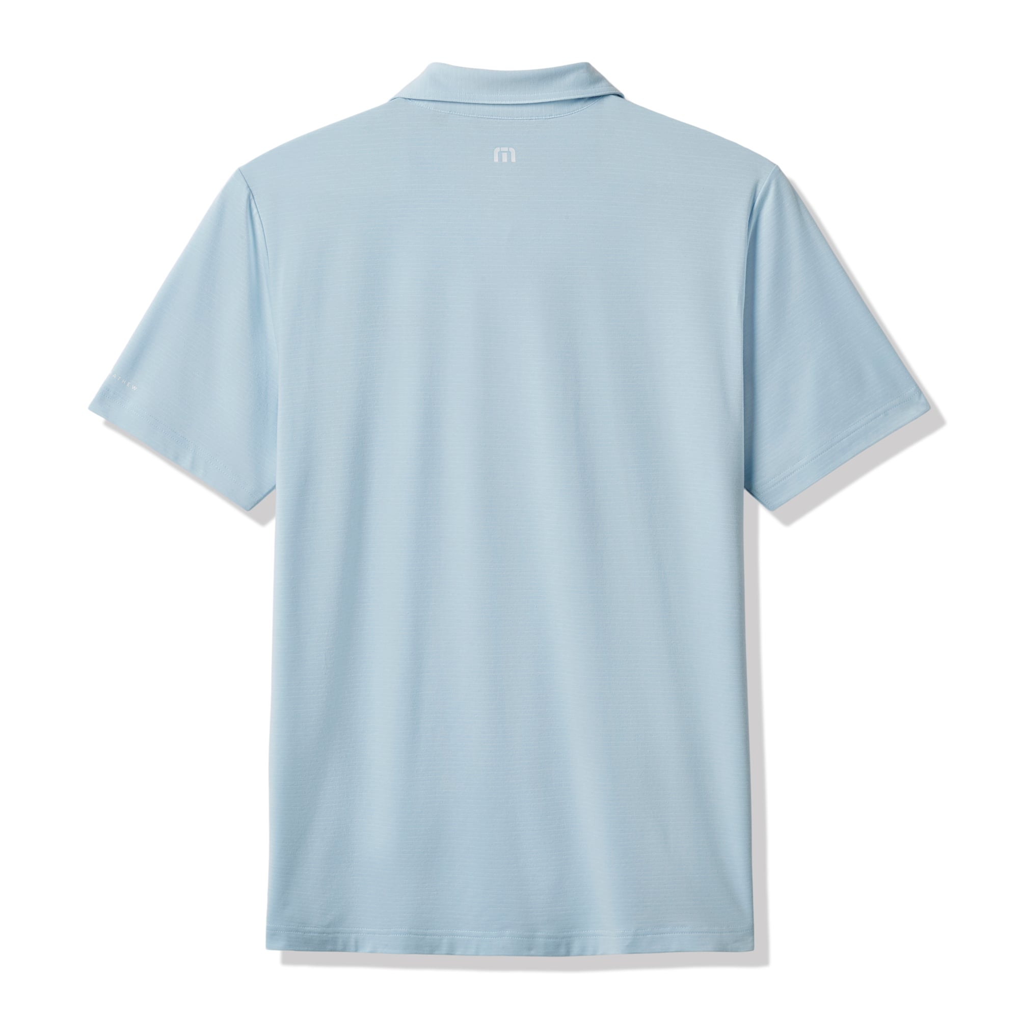 Polo TravisMathew bleu clair pour homme, modèle Halftime Show Heater de UCLA Bruins.