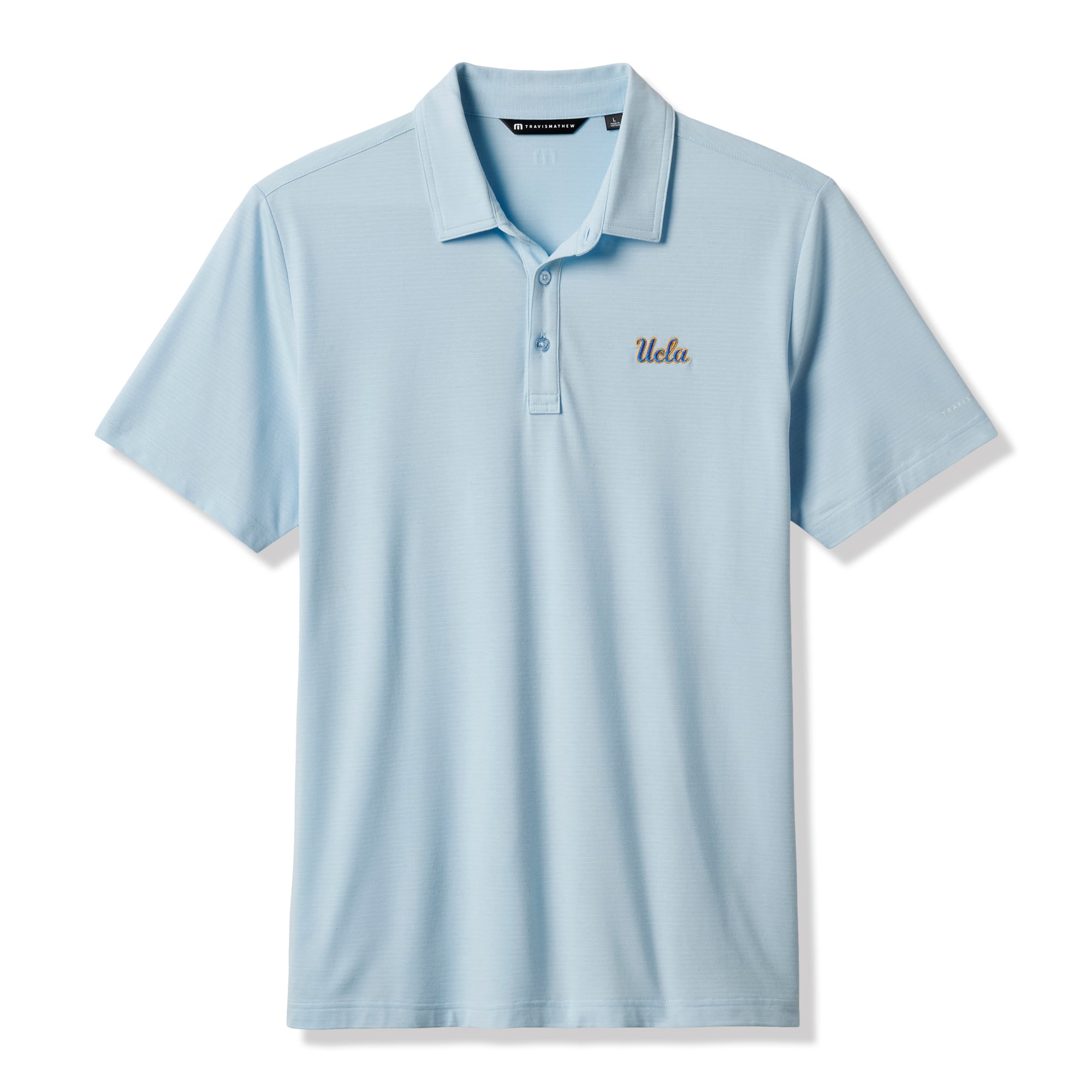 Polo TravisMathew bleu clair pour homme, modèle Halftime Show Heater de UCLA Bruins.