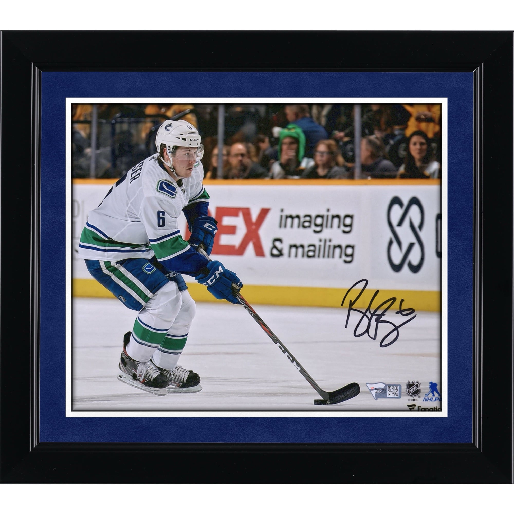 Brock Boeser Vancouver Canucks Autographed 8" x 10" White Jersey Skating with Puck Photograph
