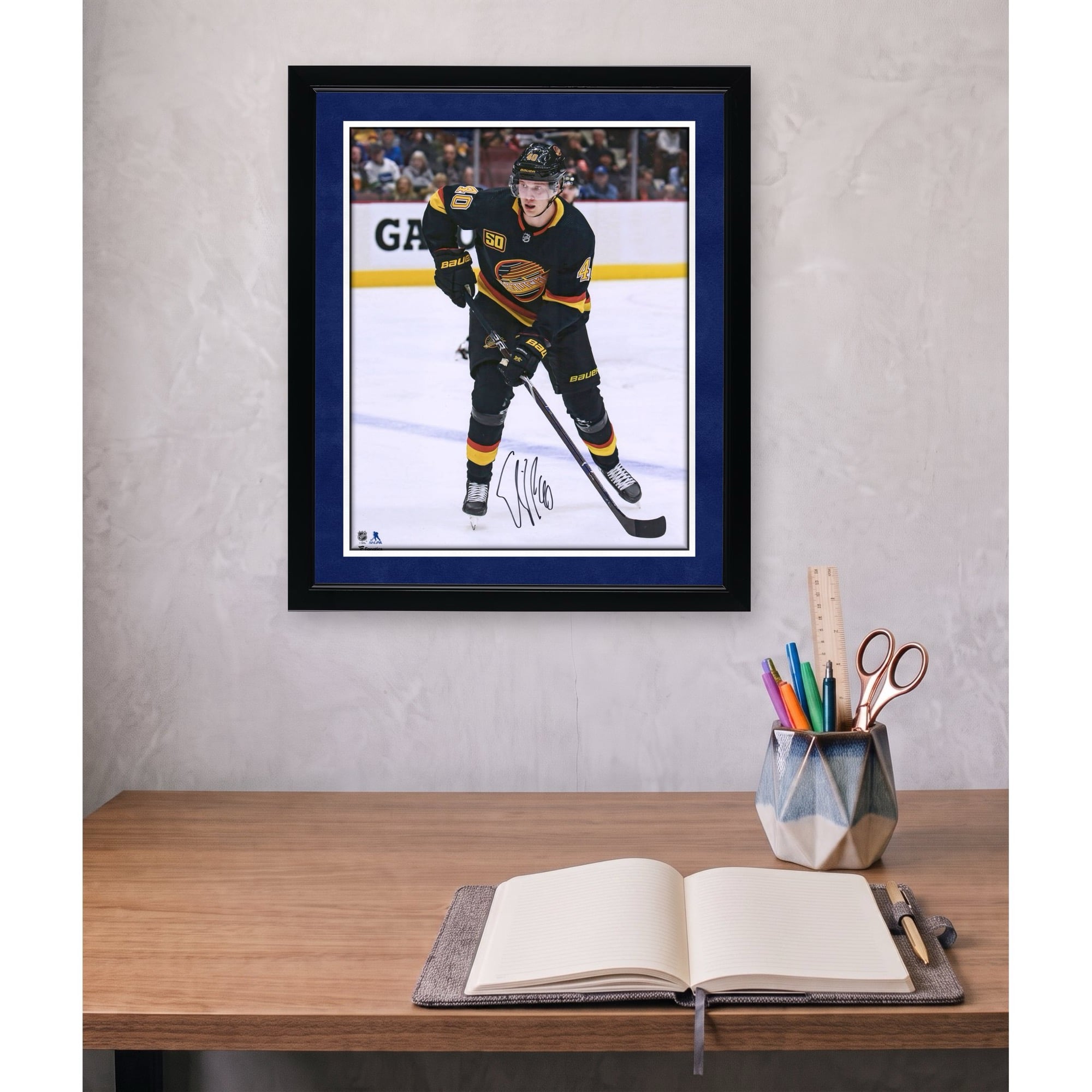 Elias Pettersson Vancouver Canucks Autographed 16" x 20" Black Alternate Jersey Skating Photograph